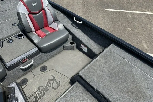 Slide: The Image of 2025 Ranger ALPHA 208 boat interior with gray and red seating, carpeted flooring. - 20