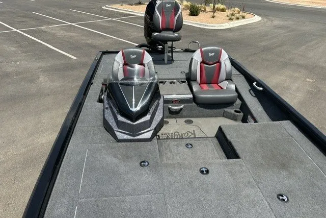 Slide: The Image of 2025 Ranger ALPHA 208 boat with dual seats and sleek design in a parking lot. - 15