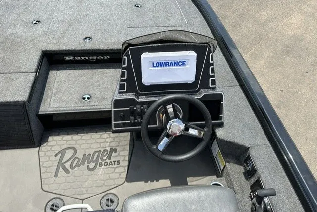 Slide: The Image of 2025 Ranger ALPHA 208 boat dashboard with Lowrance navigation system and steering wheel. - 16