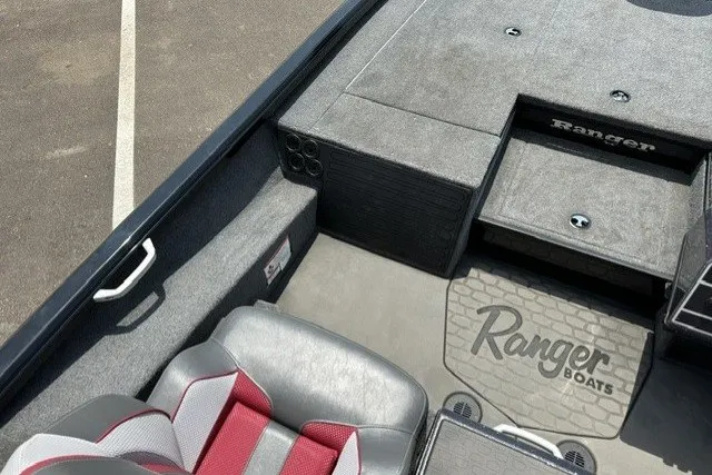 Slide: The Image of 2025 Ranger ALPHA 208 boat interior with gray and red seating, showcasing Ranger Boats branding. - 19