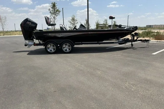 Slide: The Image of 2025 Ranger ALPHA 208 boat on trailer in parking lot under blue sky. - 8