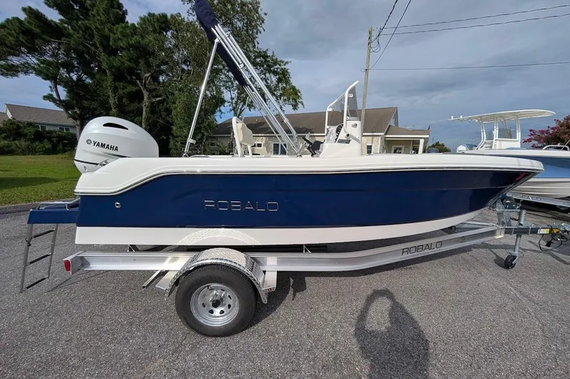 The Image of 2026 Robalo R160 Center Console boat with Yamaha engine on trailer. - 1