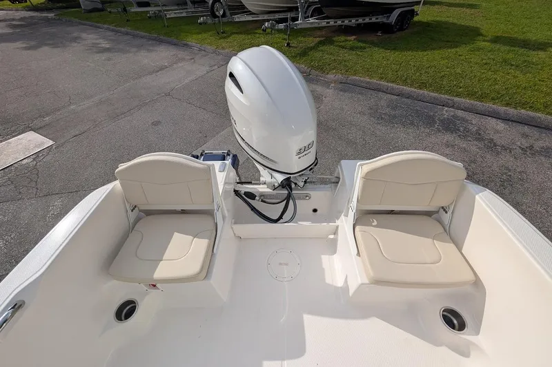 Slide: The Image of 2026 Robalo R160 Center Console boat with dual seating and outboard motor. - 10