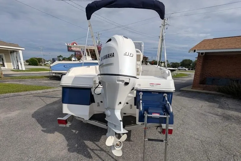 Slide: The Image of 2026 Robalo R160 Center Console boat with Yamaha engine, parked outdoors. - 3