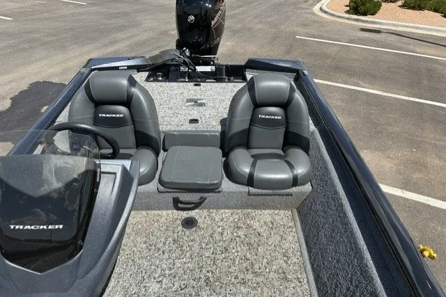 Slide: The Image of 2026 Tracker Pro Team 175 boat interior with dual seats and steering console. - 17