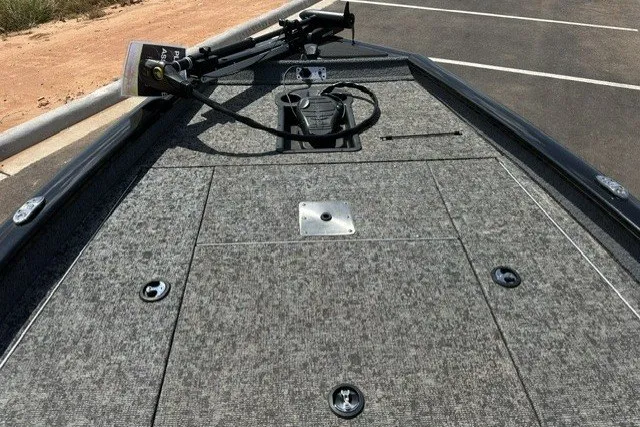 Slide: The Image of 2026 Tracker Pro Team 175 boat deck with carpeted surface and trolling motor. - 14