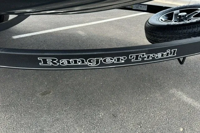 Slide: The Image of Trailer for 2025 Ranger RT188P boat with "Ranger Trail" branding in parking lot. - 3