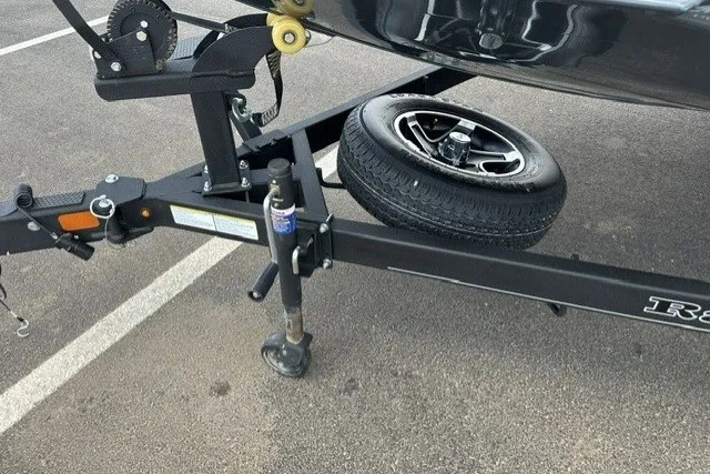 Slide: The Image of Trailer hitch and spare tire of 2025 Ranger RT188P boat on asphalt. - 8