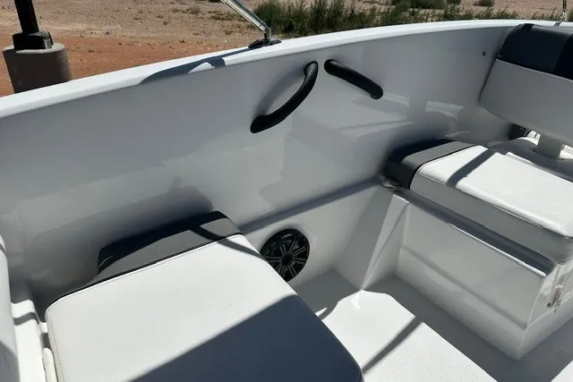 Slide: The Image of Interior of 2025 Tahoe T16 boat with white seating and speaker. - 15