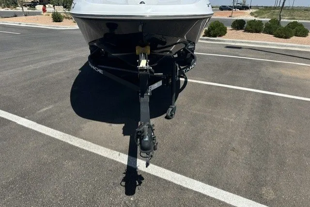 Slide: The Image of 2025 Tahoe T16 boat on trailer in parking lot, front view. - 19
