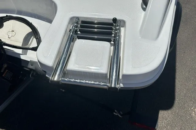 Slide: The Image of 2025 Tahoe T16 boat with a stainless steel retractable swim ladder on the deck. - 6
