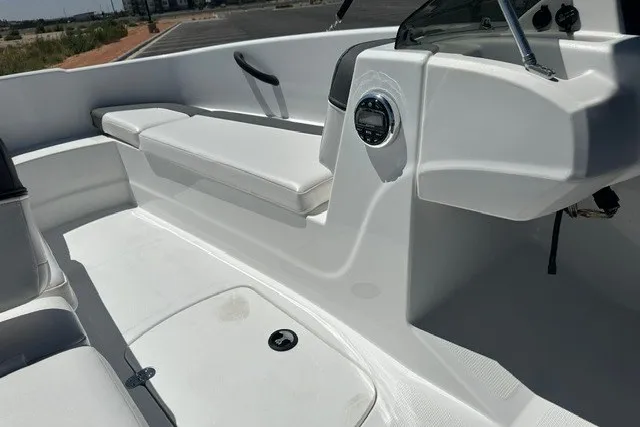 Slide: The Image of 2025 Tahoe T16 boat interior with white seating and sleek dashboard design. - 11