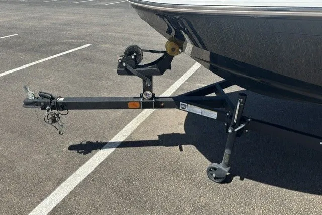 Slide: The Image of 2025 Tahoe T16 boat trailer hitch in a parking lot. - 18