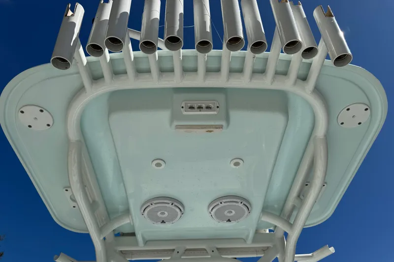 Slide: The Image of Underside view of 2017 Yellowfin 24 Bay CE boat's T-top with rod holders. - 15