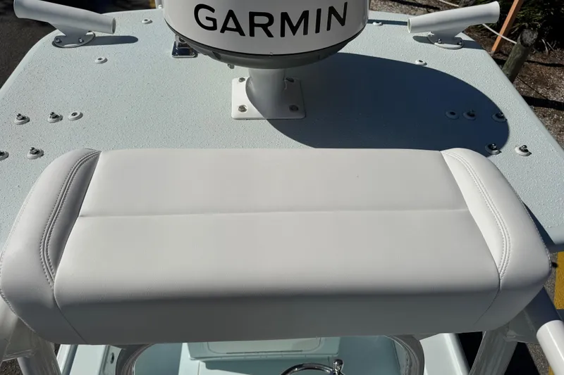 Slide: The Image of 2017 Yellowfin 24 Bay CE boat with Garmin equipment and cushioned seating. - 18
