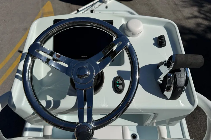 Slide: The Image of Steering console of 2017 Yellowfin 24 Bay CE boat with Garmin equipment. - 19