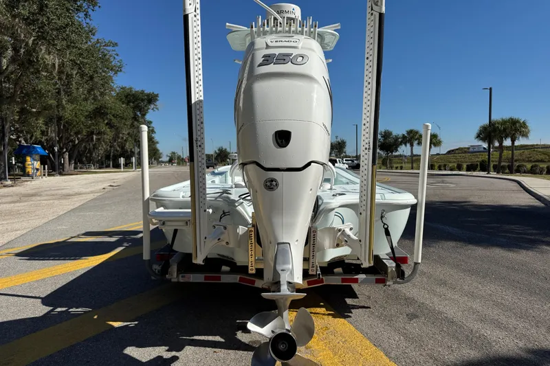 Slide: The Image of 2017 Yellowfin 24 Bay CE boat with powerful outboard motor on a trailer. - 2