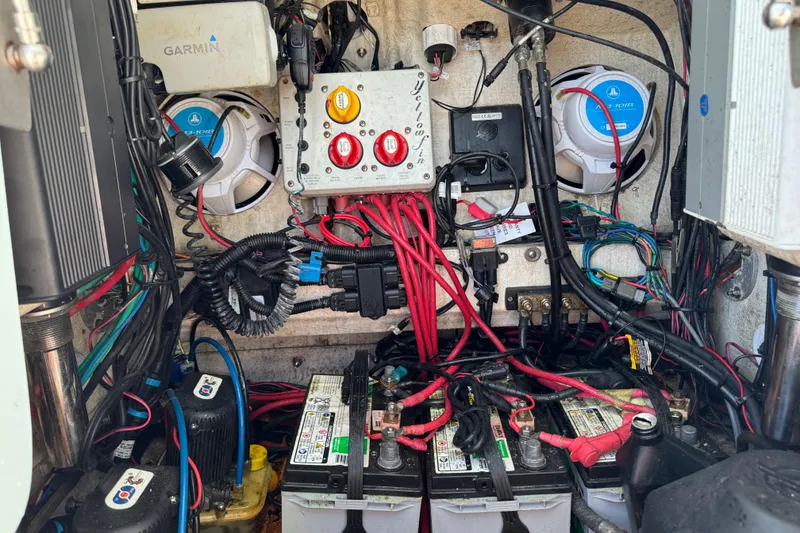 Slide: The Image of Electrical system inside a 2017 Yellowfin 24 Bay CE boat, featuring batteries and wiring. - 23