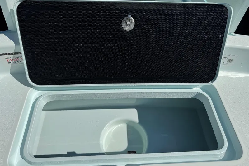 Slide: The Image of Open storage compartment on 2017 Yellowfin 24 Bay CE boat. - 30
