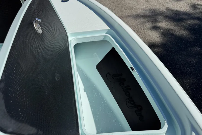 Slide: The Image of Open storage compartment on a 2017 Yellowfin 24 Bay CE boat. - 32