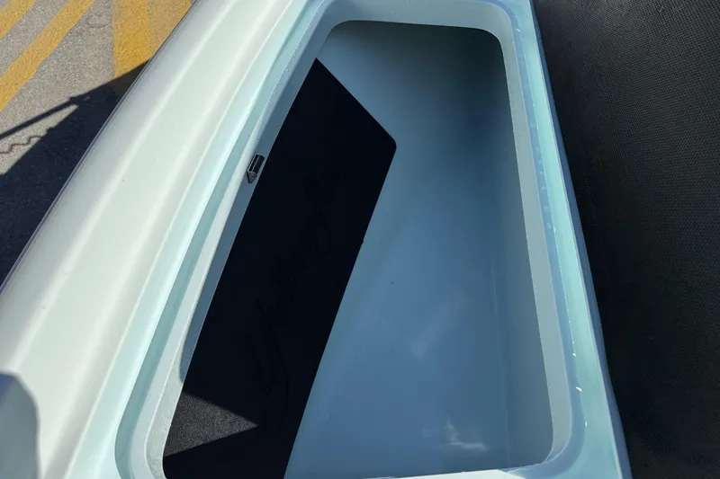 Slide: The Image of 2017 Yellowfin 24 Bay CE boat storage compartment, open and empty. - 34