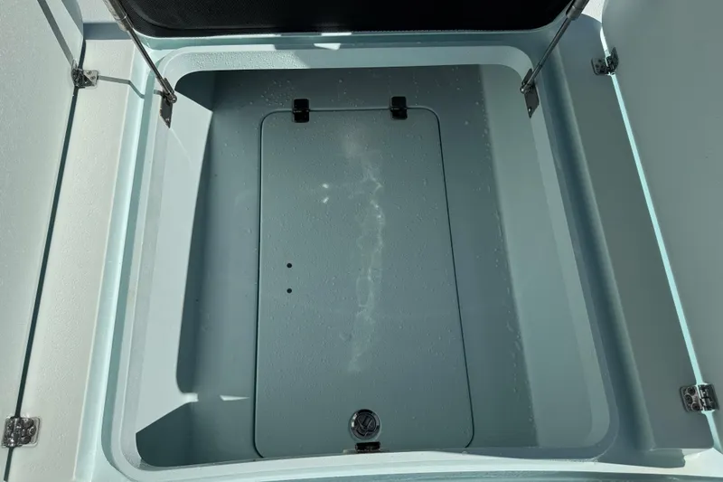 Slide: The Image of Open storage compartment on a 2017 Yellowfin 24 Bay CE boat. - 36