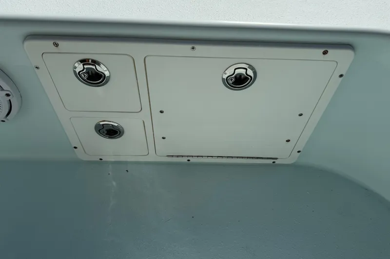 Slide: The Image of 2017 Yellowfin 24 Bay CE boat hatch with secure latches and clean design. - 43