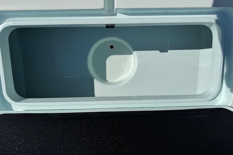 Slide: The Image of Livewell compartment of 2017 Yellowfin 24 Bay CE boat, open and empty. - 45