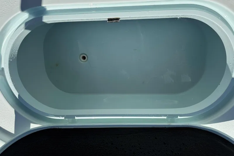 Slide: The Image of Livewell compartment on a 2017 Yellowfin 24 Bay CE boat, open and empty. - 9