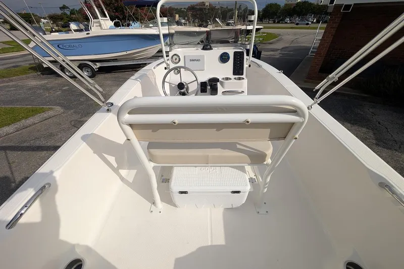 Slide: The Image of 2026 Robalo R160 Center Console boat interior with steering wheel and seating. - 11