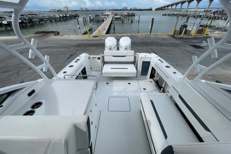 Slide: The Image of 2022 Blackfin 272 DC boat interior with spacious seating and waterfront view. - 12