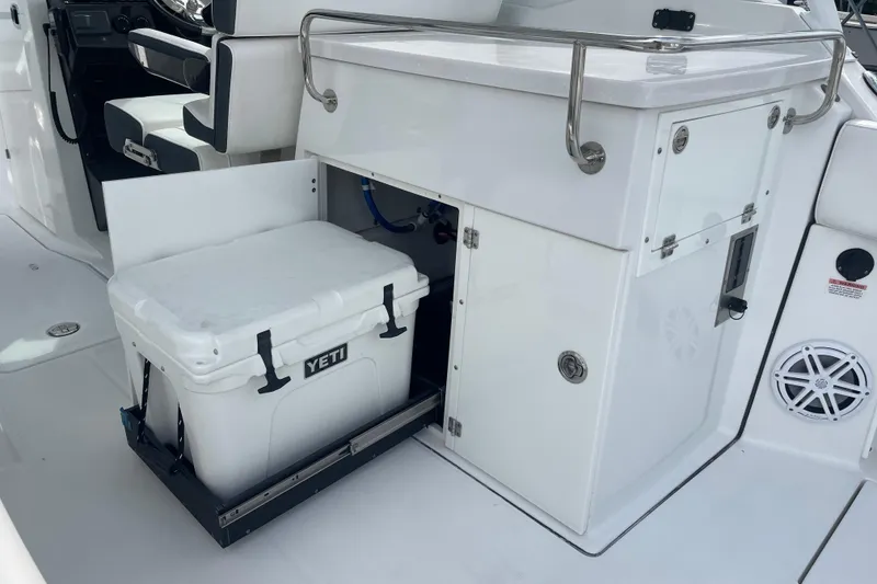 Slide: The Image of 2022 Blackfin 272 DC boat interior with Yeti cooler storage compartment. - 17