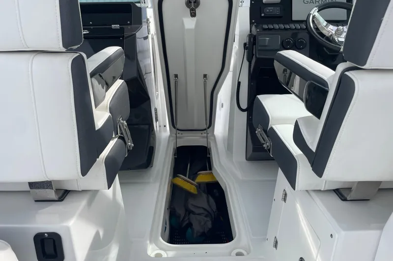 Slide: The Image of Interior of 2022 Blackfin 272 DC boat with white and black seating. - 19