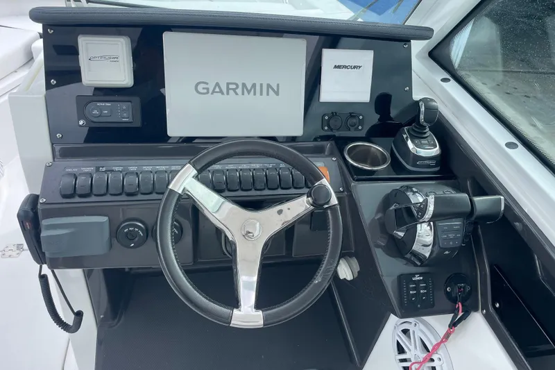 Slide: The Image of 2022 Blackfin 272 DC boat dashboard with Garmin navigation and Mercury controls. - 9