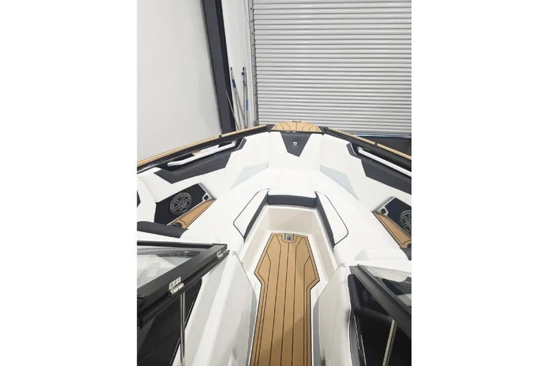 Slide: The Image of 2026 Nautique Super Air Nautique S21 boat interior with sleek design and wood accents. - 3