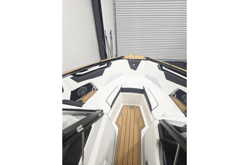 Slide: The Image of 2026 Nautique Super Air Nautique S21 boat interior with sleek design and wood accents. - 4