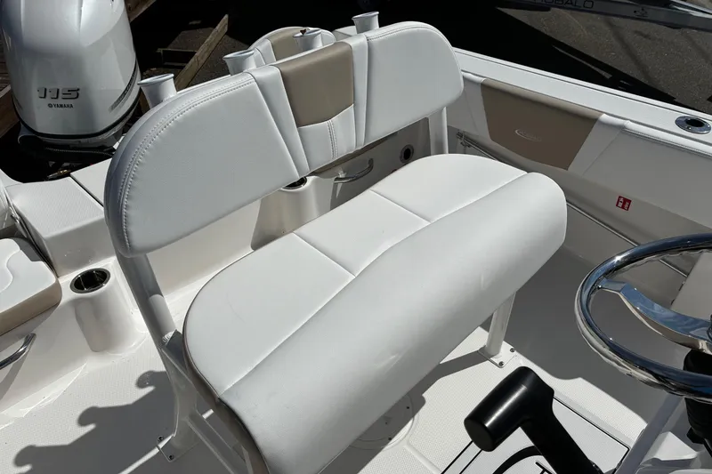 Slide: The Image of 2026 Robalo R180 Center Console boat interior with white seating and Yamaha engine. - 8