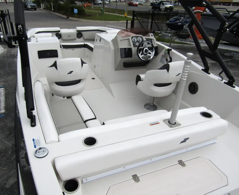 Slide: The Image of 2024 Starcraft SVX 231 OB DH boat interior with modern seating and steering console. - 39