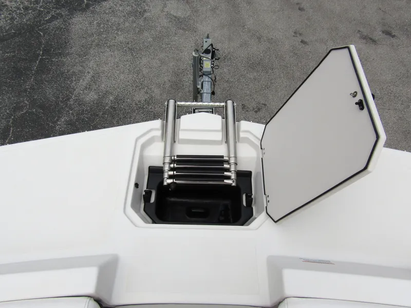 Slide: The Image of 2024 Starcraft SVX 231 OB DH boat with open hatch and ladder. - 7