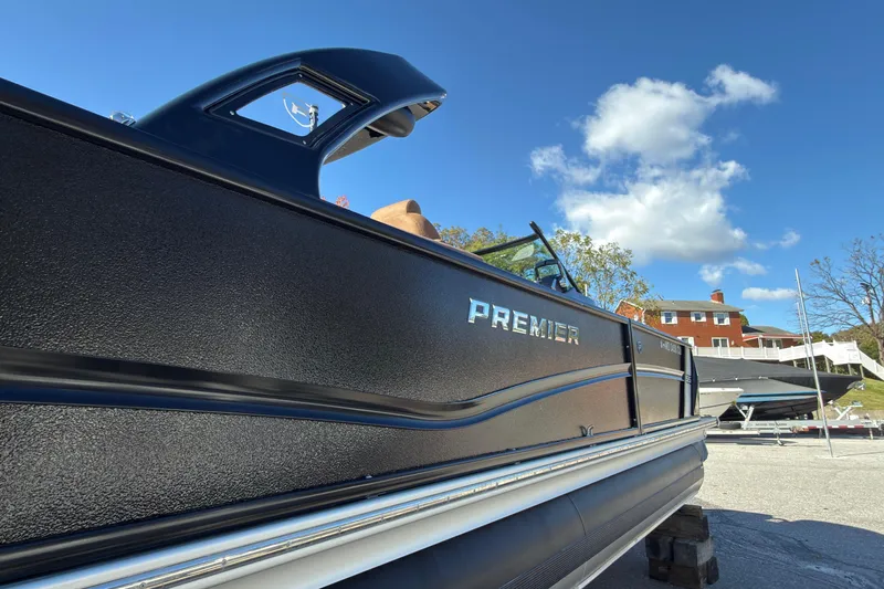 Slide: The Image of 2024 Premier Supersport boat on display under a clear blue sky. - 3