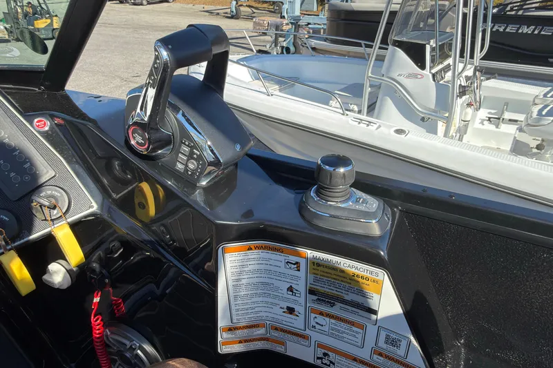 Slide: The Image of 2024 Premier Supersport boat control panel with joystick and throttle lever. - 6