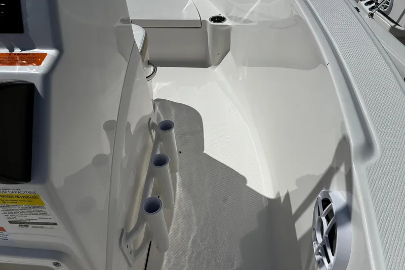 Slide: The Image of 2026 Robalo R180 Center Console interior with rod holders and speaker. - 5