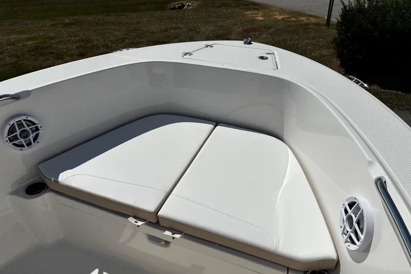Slide: The Image of 2026 Robalo R180 Center Console boat with cushioned seating and speakers. - 13