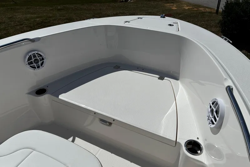 Slide: The Image of 2026 Robalo R180 Center Console boat interior with seating and speakers. - 16