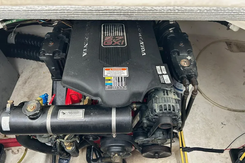 Slide: The Image of Engine compartment of a 2007 Chaparral Signature 240 boat, featuring a Volvo Penta 5.7 GXI engine. - 16