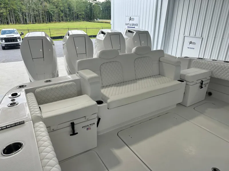 Slide: The Image of 2025 HCB Lujo boat interior with luxurious seating and multiple outboard engines. - 15