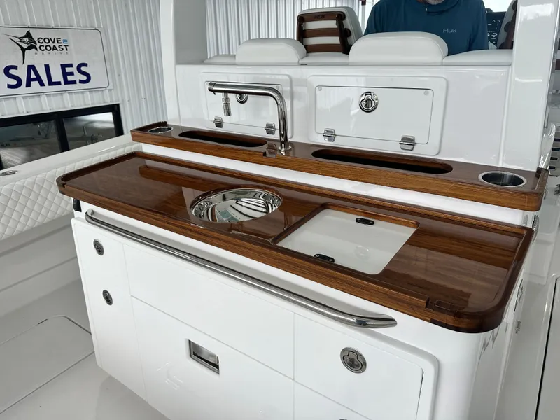 Slide: The Image of 2025 HCB Lujo boat interior with sleek kitchen area and modern amenities. - 20