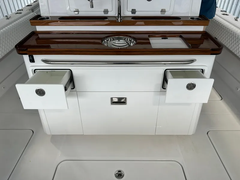 Slide: The Image of 2025 HCB Lujo boat interior with sleek cabinetry and modern design. - 21