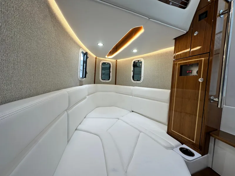 Slide: The Image of Luxurious 2025 HCB Lujo boat interior with elegant seating and modern lighting. - 25