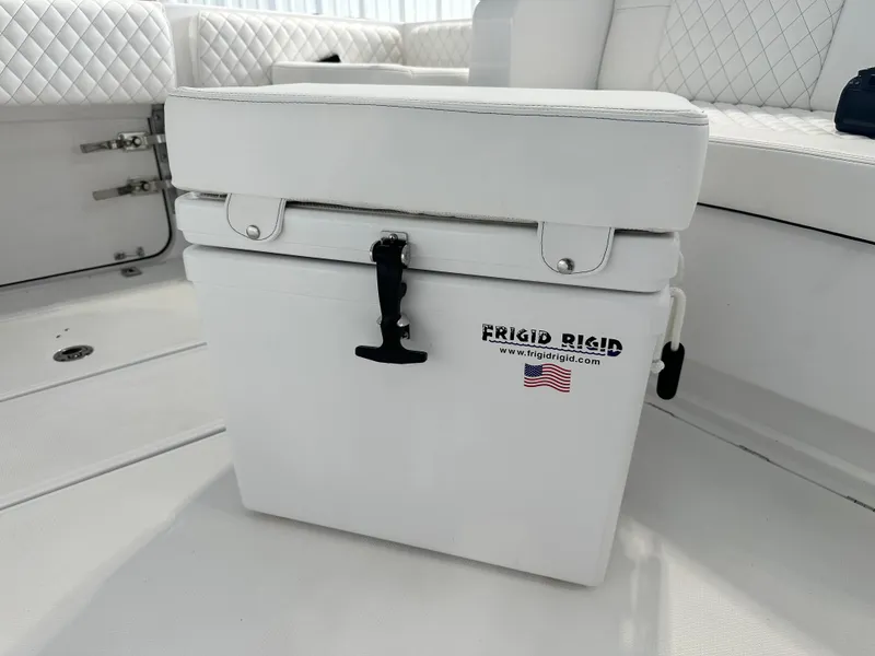 Slide: The Image of White Frigid Rigid cooler on 2025 HCB Lujo boat deck. - 37